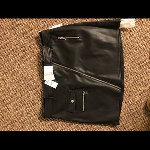 Black pleather skirt with zipper and pockets. Never worn.